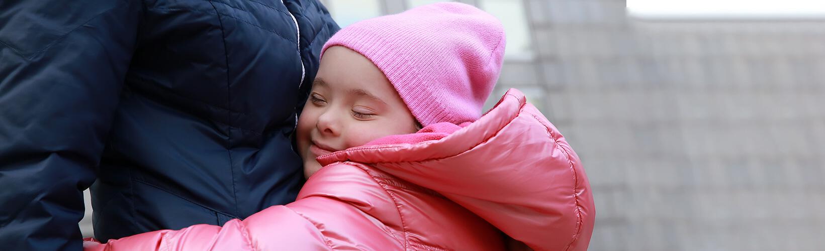 girl hugging parent