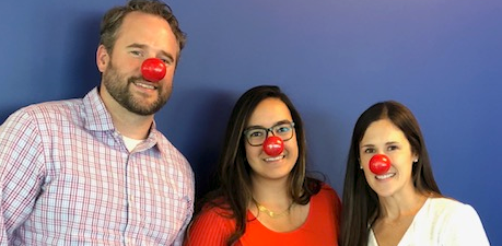 people wearing clown noses