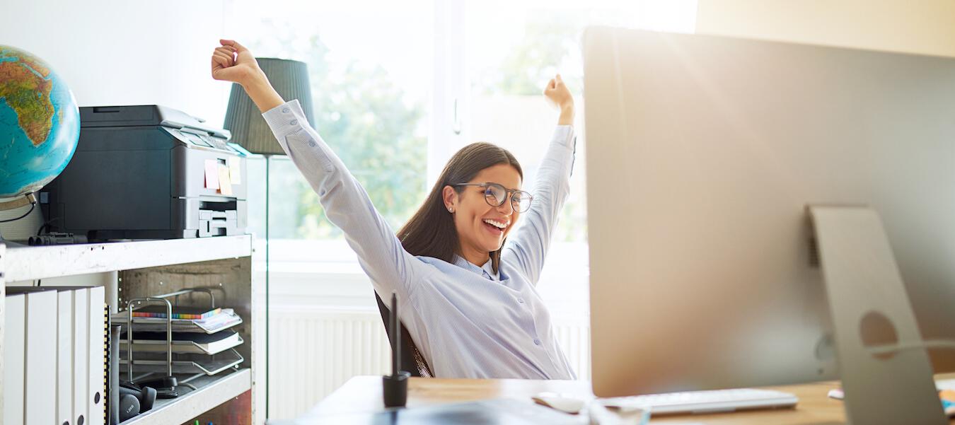 woman stretching at desk
