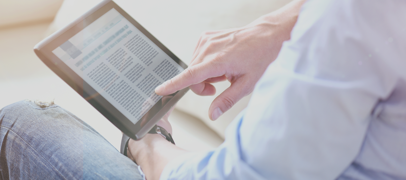 person reading article on tablet