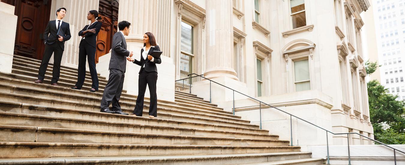 man and woman talking on stairs