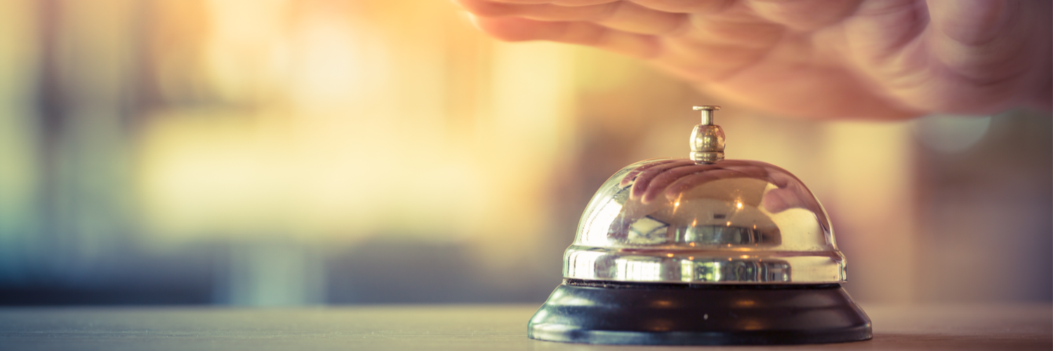 hand ringing bell at hotel