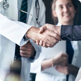 doctor shaking hands with patient