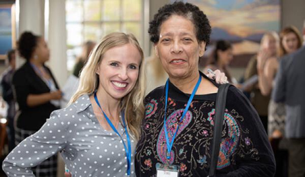 two woman at a conference